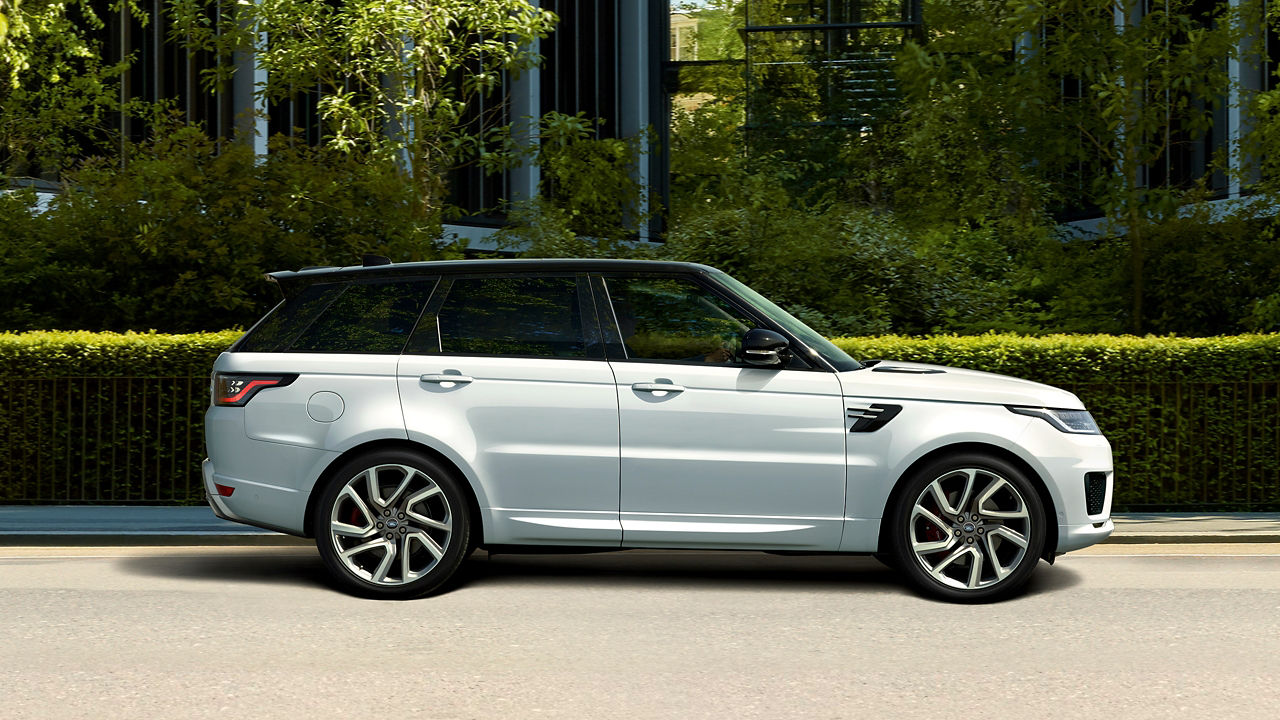 Parked Range Rover Sport outside of Grass Background