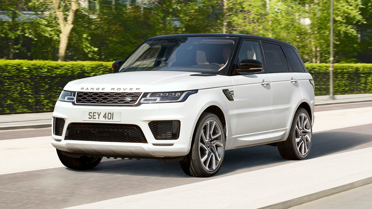 White Range Rover sport driving