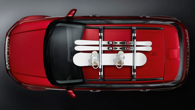 Range Rover Evoque Roof Racks with Skiing accessories placed on it