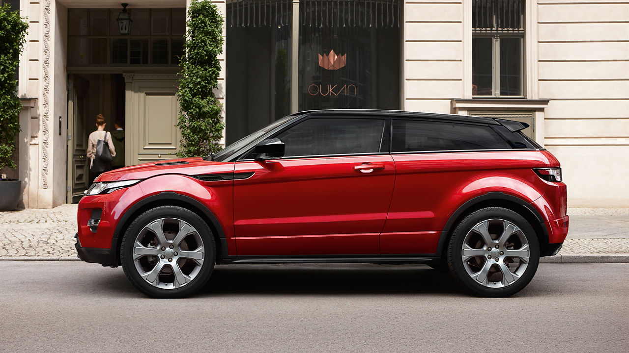 Red Evoque parked in front of building