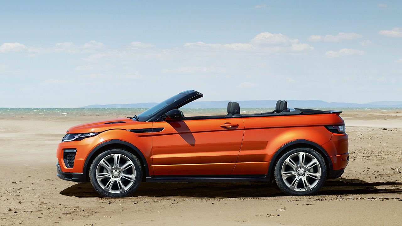 Parked Range Rover on beach 