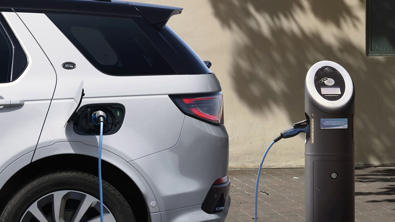 Parked Discovery Sport charging at the phev station point