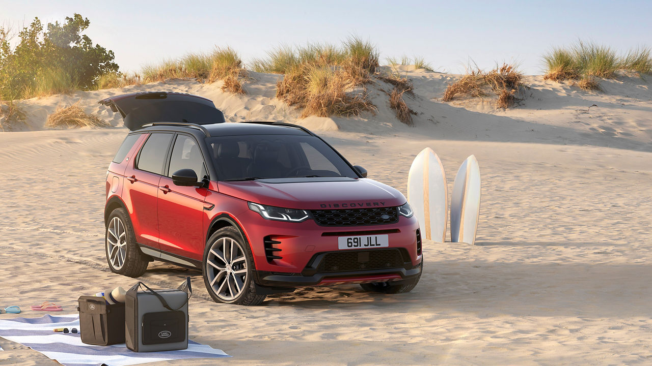 Discovery sports parked on beach