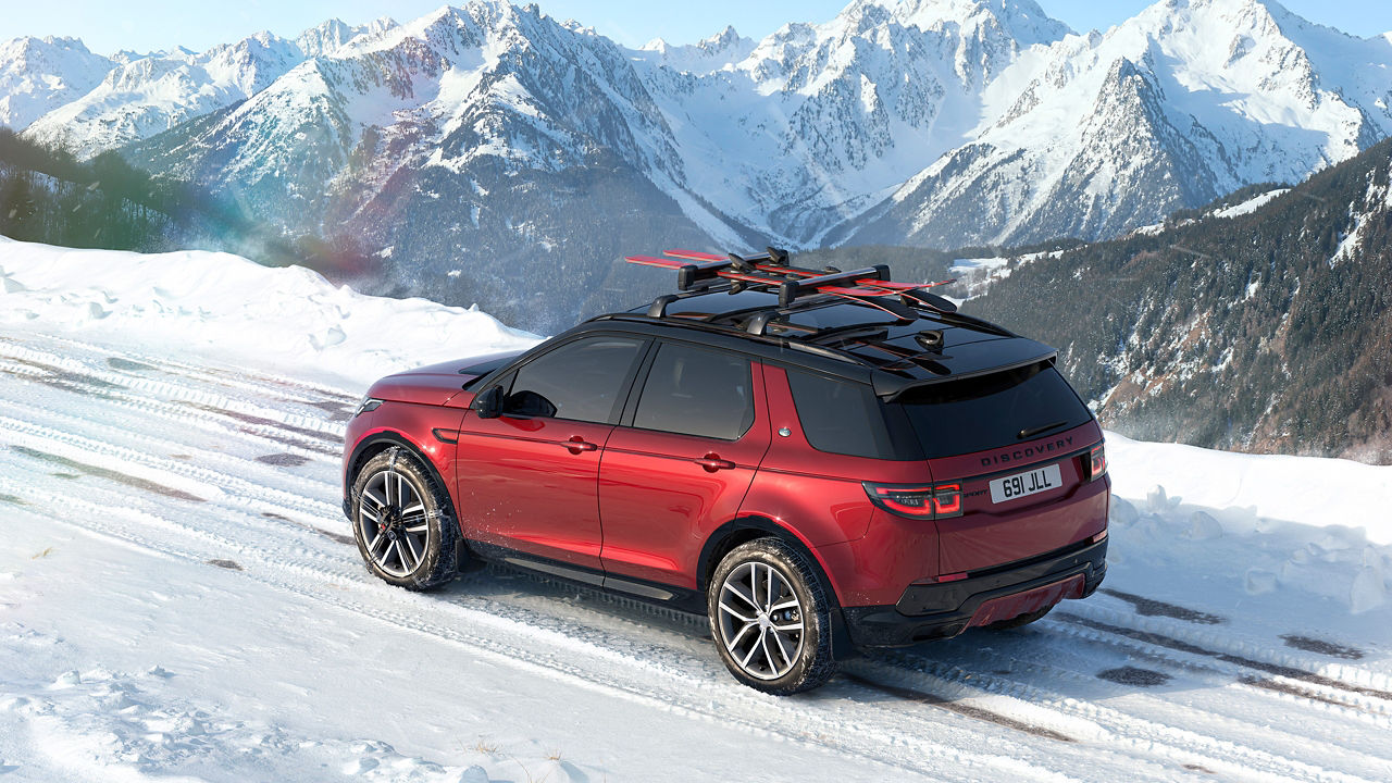 Discovery sports driving on mountain hill road
