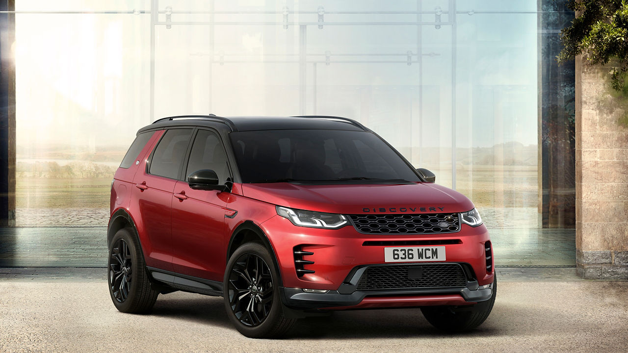 Discovery Sport parked outside of glass house