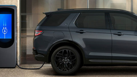 Discovery sport standing at charging Phev point
