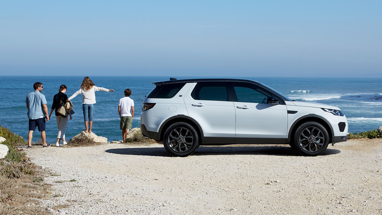 Family Picnic On A Beach Side With Discovery