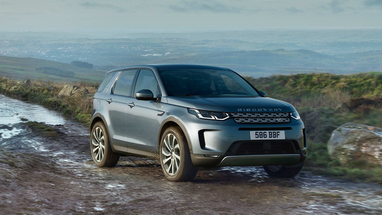 Discovery Sport in Blue driving in mud