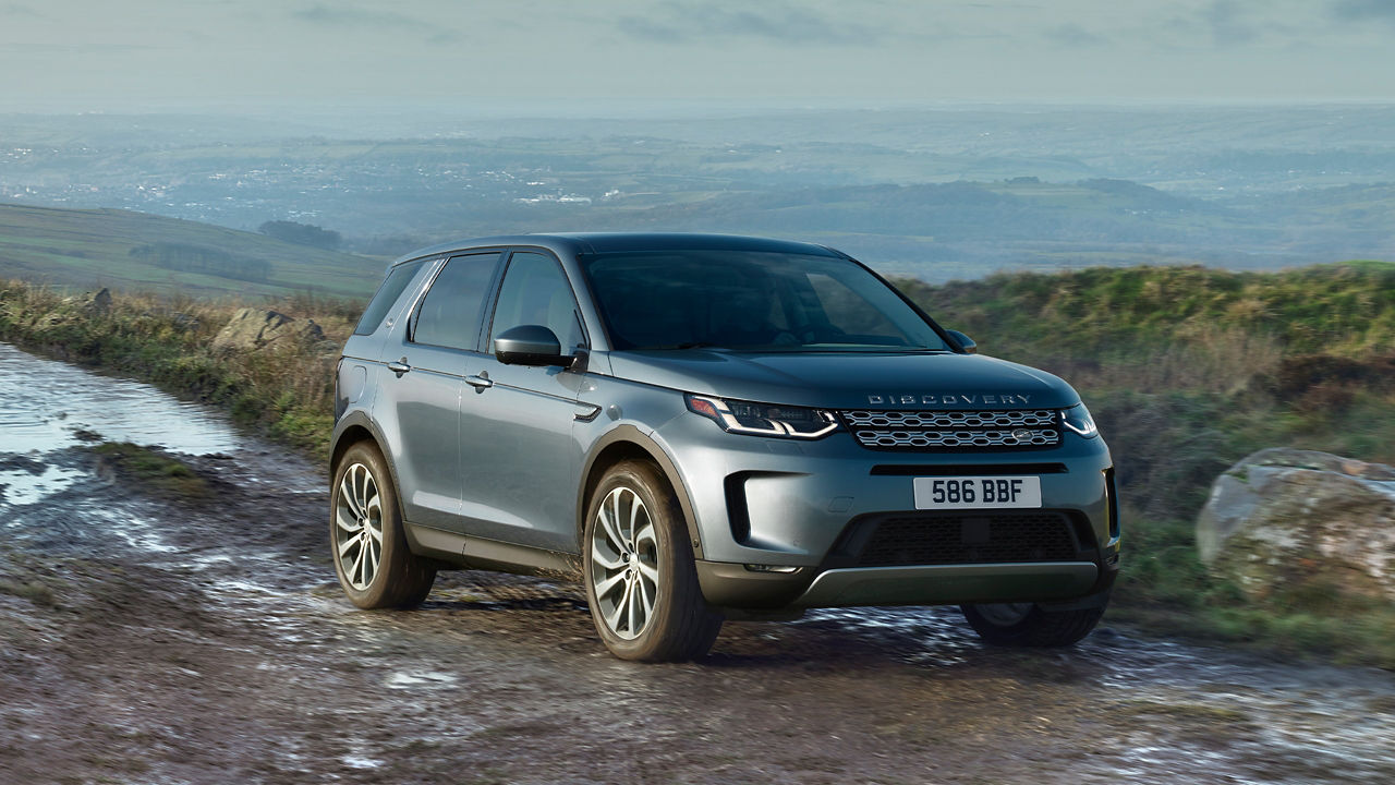 Parked Discovery Sport on muddy off road