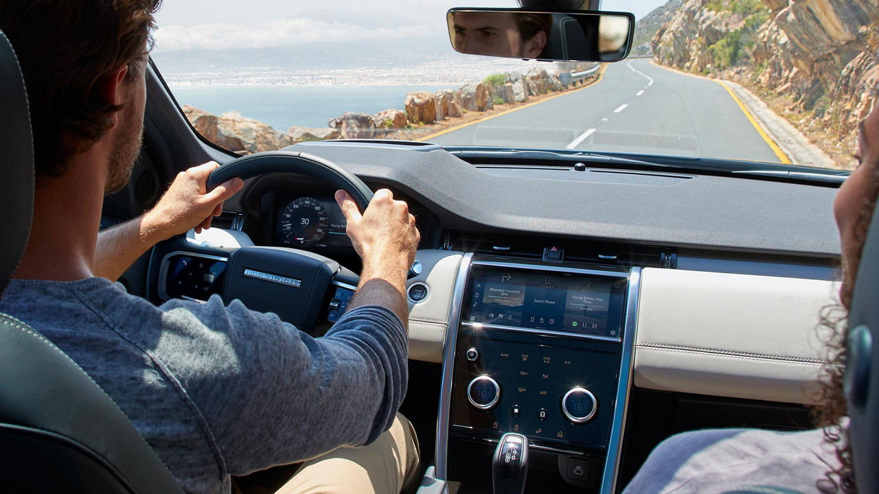 Man Driving a Discovery Sport