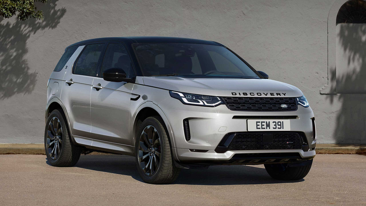 Discovery Sport Parked In Near Of A Brick Wall