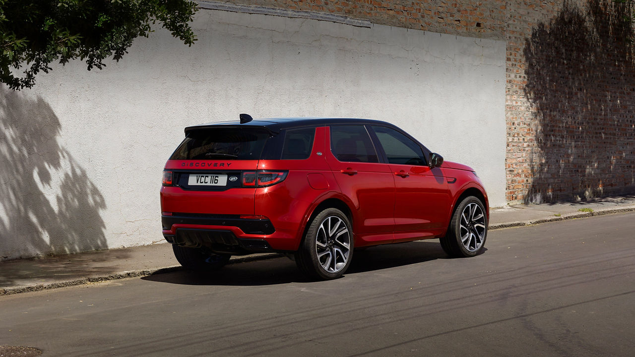 Discovery Sport Parked In Near Of A Brick Wall