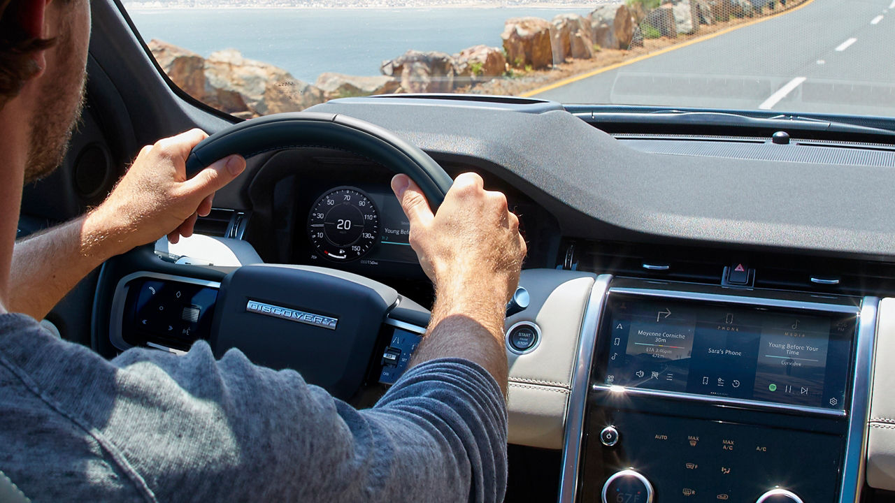 Man is Driving Discovery Sport on Mountain Runway Road