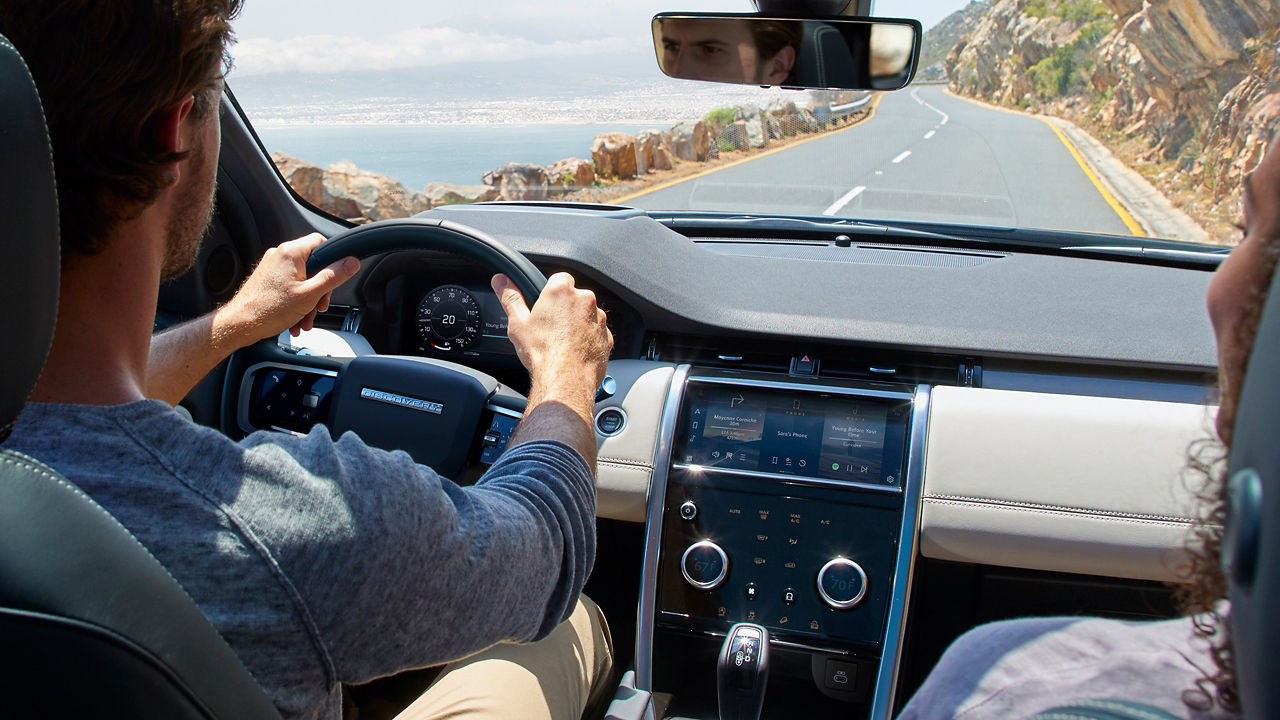 Man is Driving Discovery Sport on Mountain Runway Road