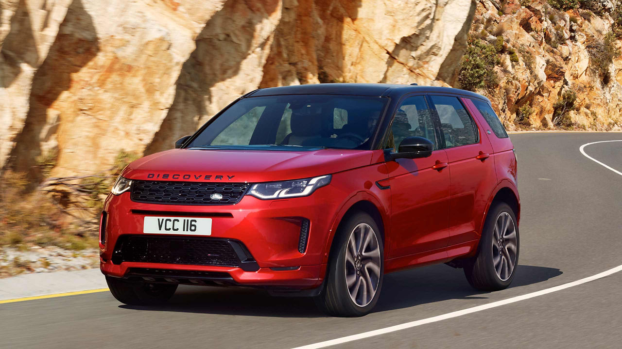 Discovery Sport in Red Driving down the Road