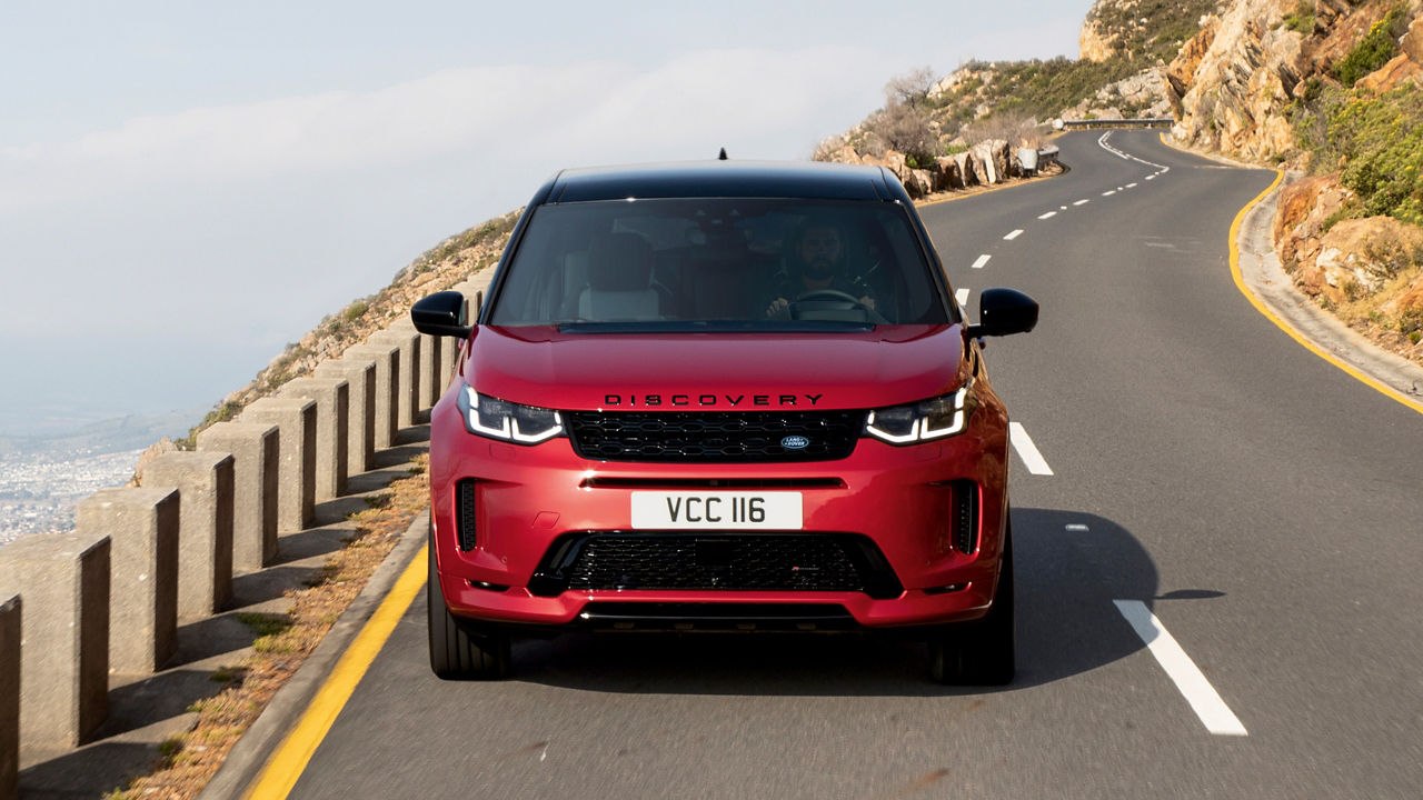 Man is Driving Discovery Sport on Mountain Runway Road