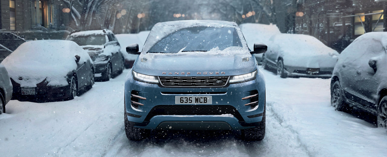 Evoque driving through snowy street