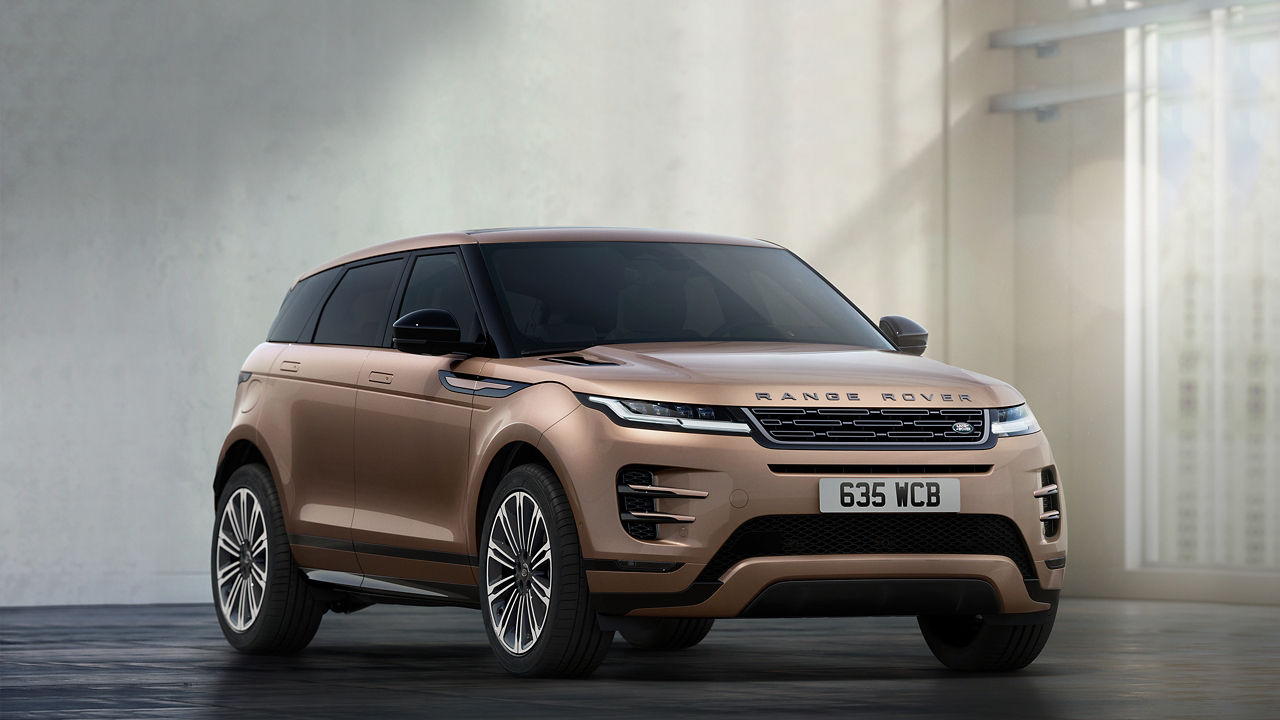 Range Rover Evoque in Corinthian Bronze parked inside a contemporary building with 5 years warranty watermark.