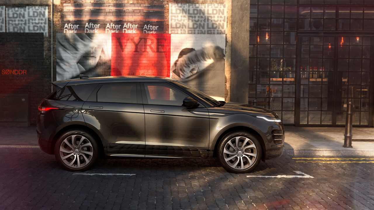 Range Rover Evoque parked beside footpath side view