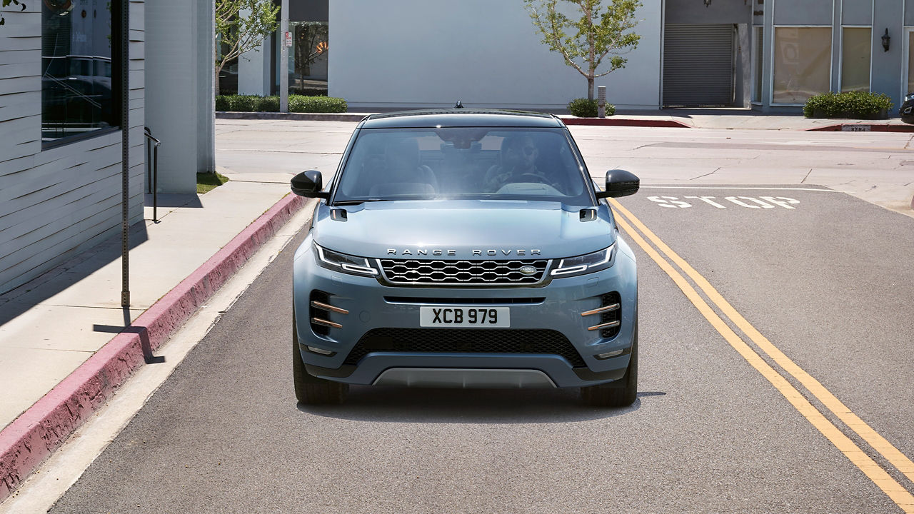 Front View Of Man Driving Evoque