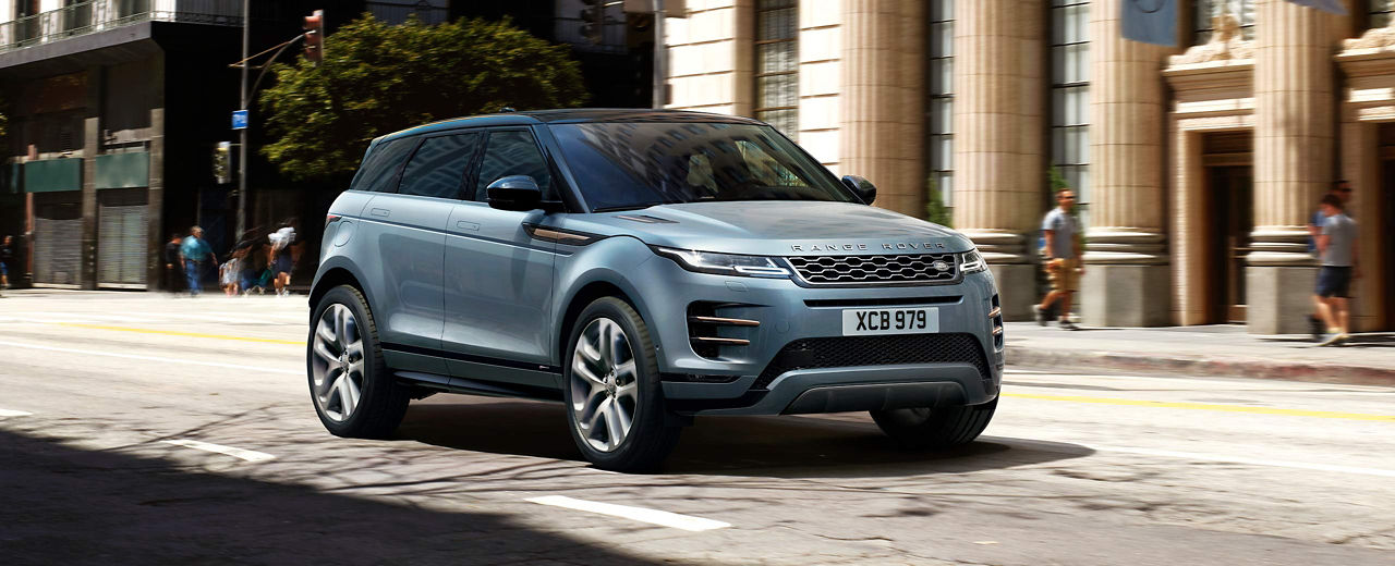 Range Rover Evoque (blue) driving on road