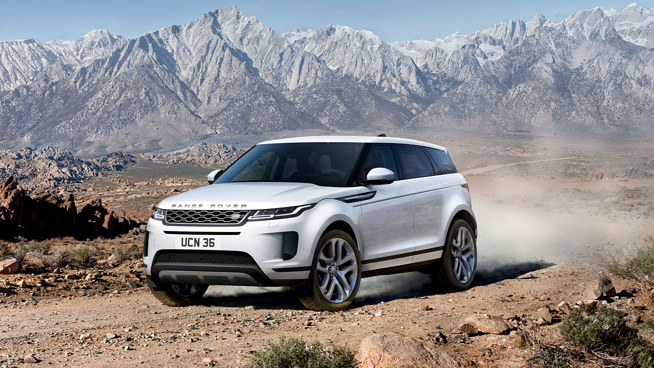 Evoque Driving Down A Mountain Dirt Road