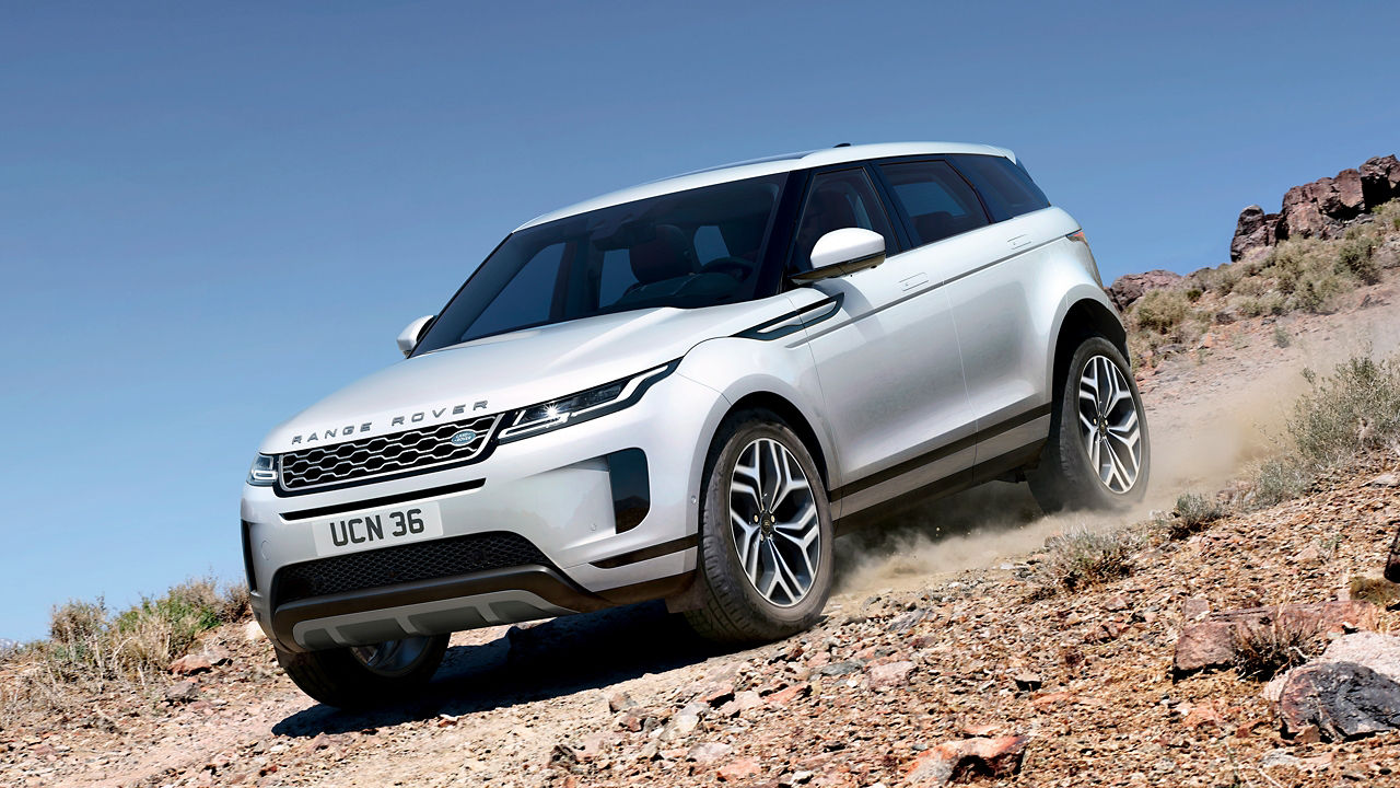 Evoque Driving Down A Mountain Dirt Road