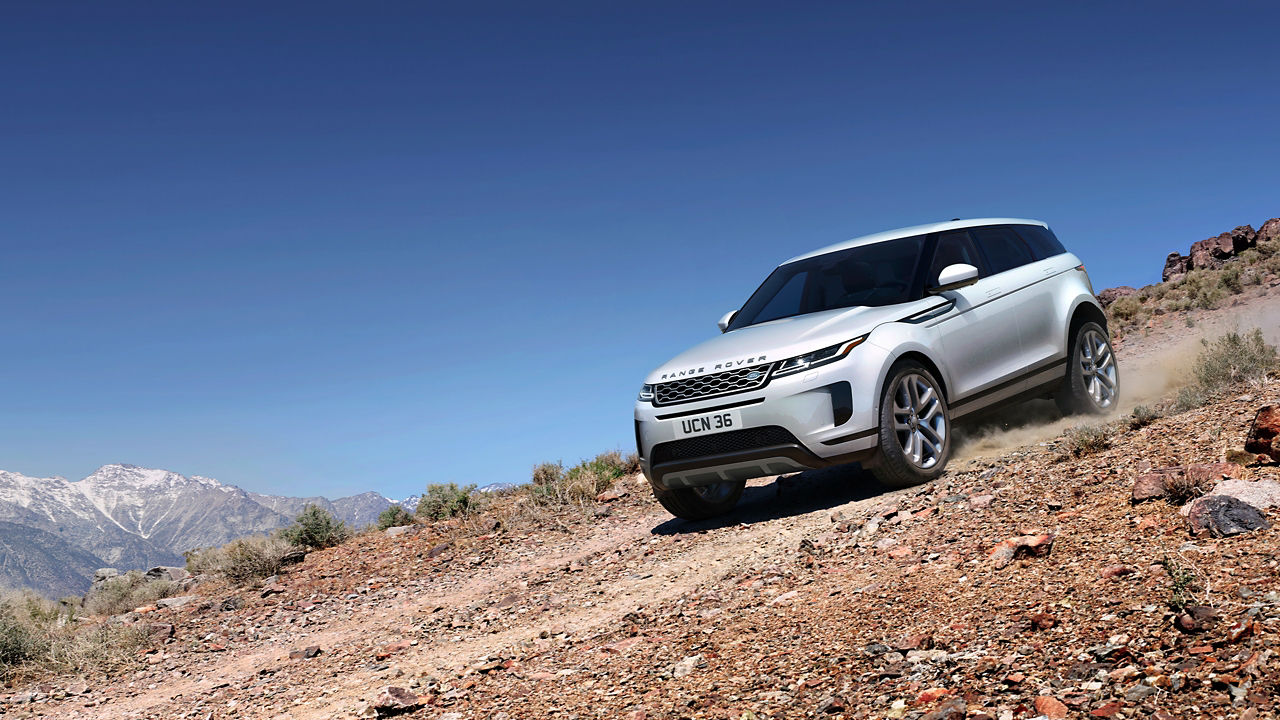 Evoque Driving Down A Mountain Dirt Road