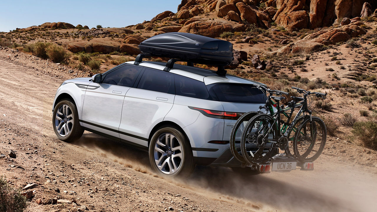 Evoque With Roof Luggage Box For Travel On The Mountain Road