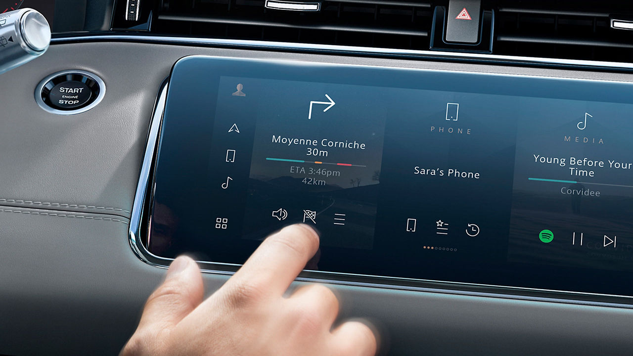 Close up mans hand select the application of navigation or maps on the car dashboard