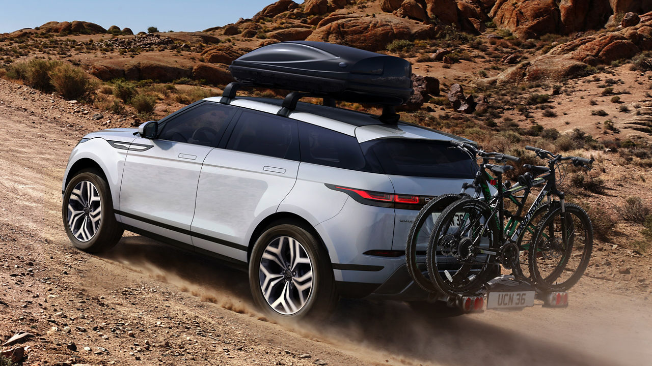 Evoque With Roof Luggage Box For Travel On The Mountain Road