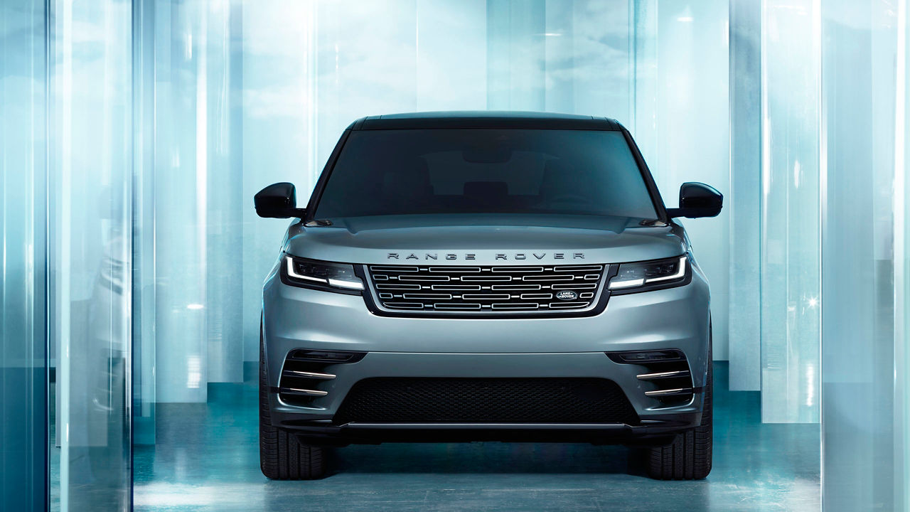 Front view of the Range Rover Velar with glass background