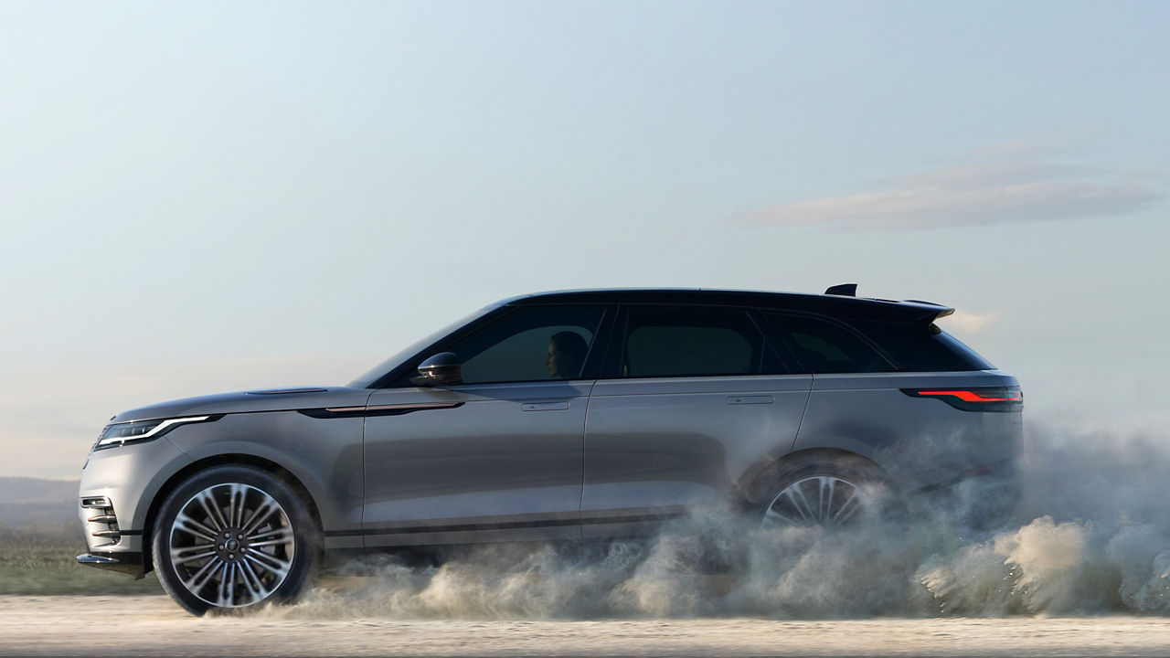 Range Rover Velar Driving Over Dust Road