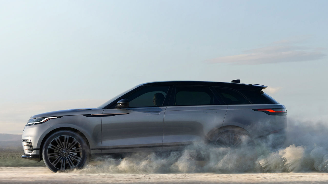 Range Rover Velar Driving Over Dust Road