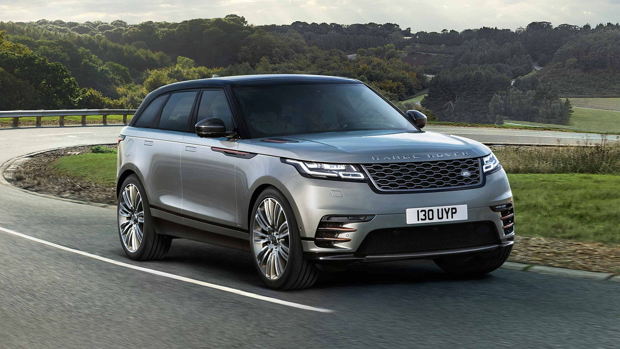 Grey Range Rover Velar driving on the road