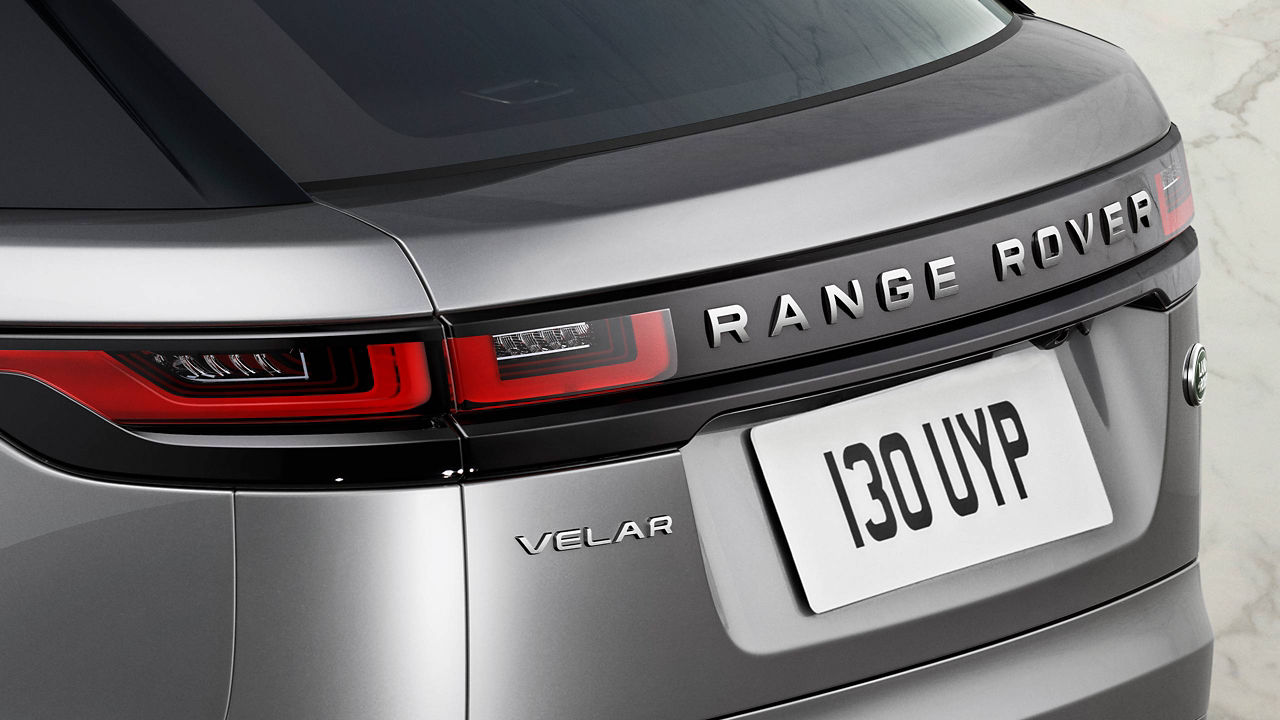 The back of a silver Range Rover Velar