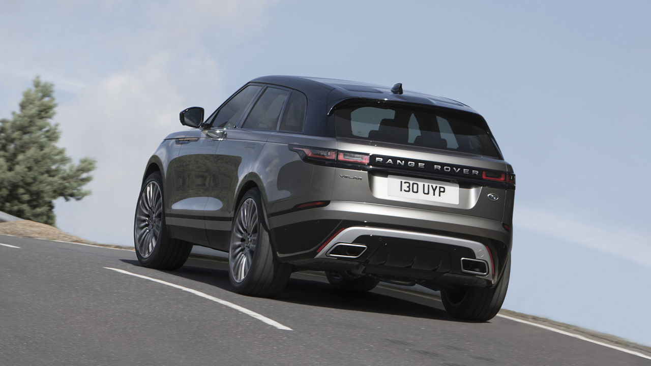 Velar Is Climbing By Narrow Mountain Curvy Road