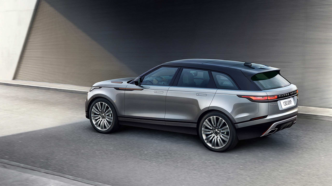 Velar Car Driving On Asphalt Road