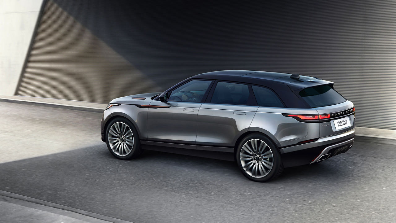 Velar Car Driving On Asphalt Road