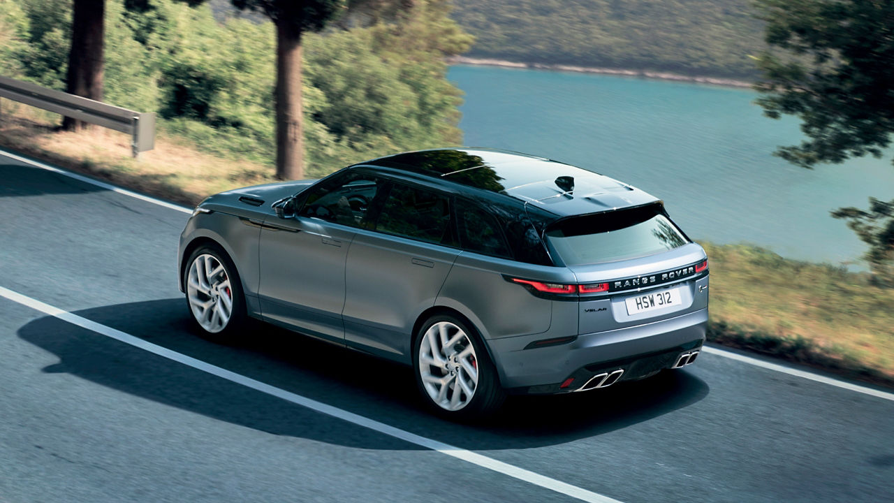 Range Rover Velar Car moving on Hilly Sea Side Road