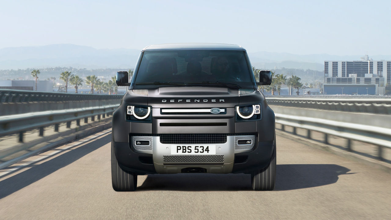 Defender Carprathian Grey driving on Road