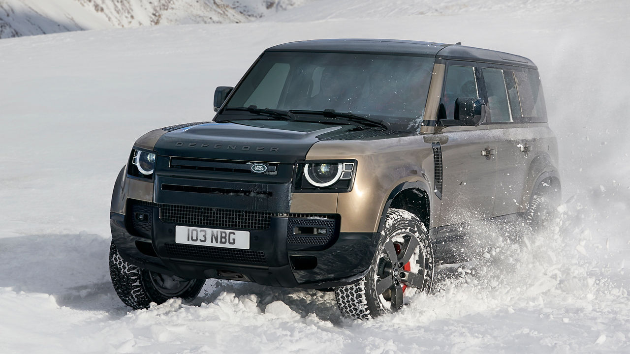 Defender driving on snowy off-road