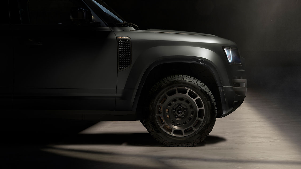 The raised Defender OCTA ride height and 20 inch multi spoke diamond turned face dark tint finish with satin black contrast wheels