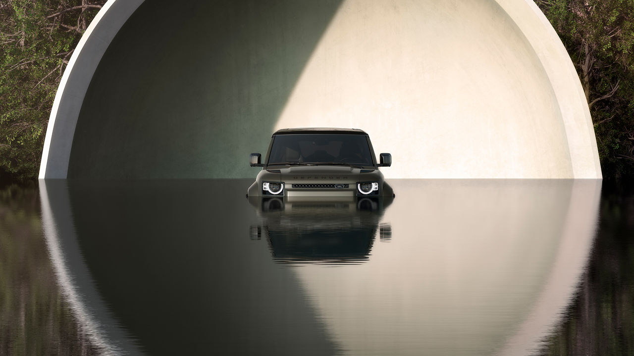 2025 Land Rover Defender OCTA halfway submerged in creek