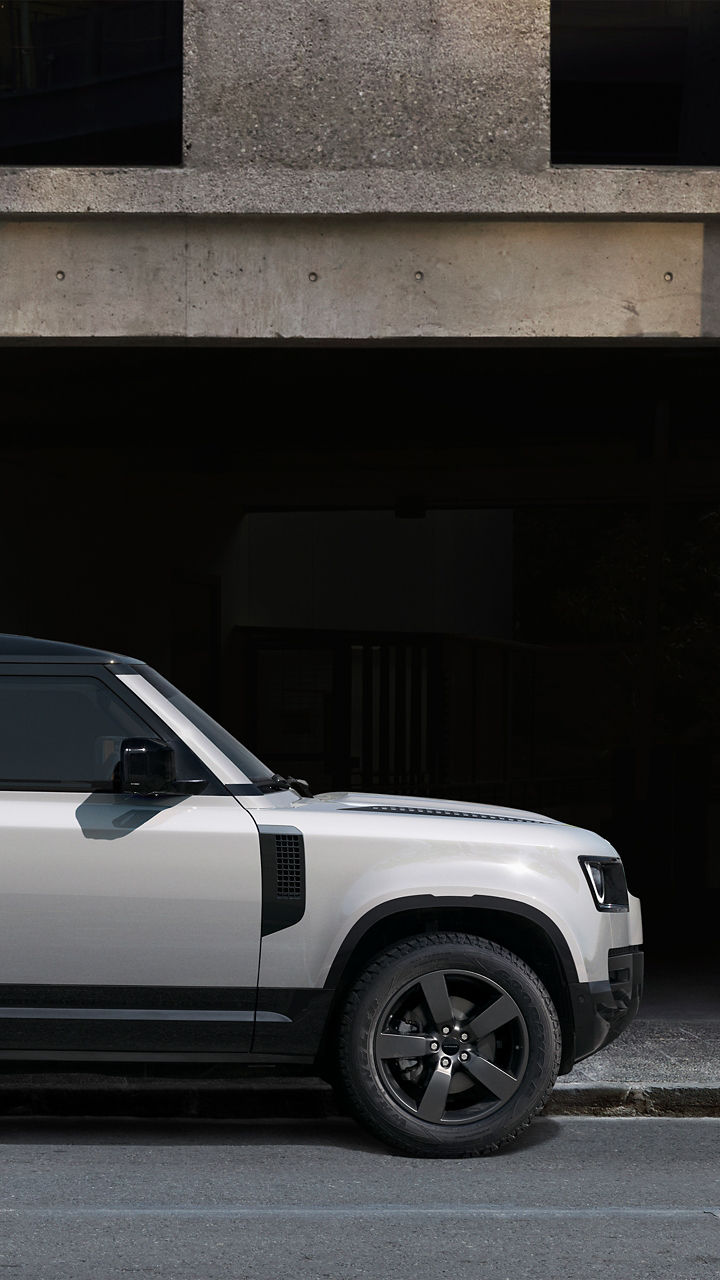 Defender side view parked on Road