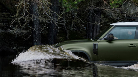 Defender sailing in water