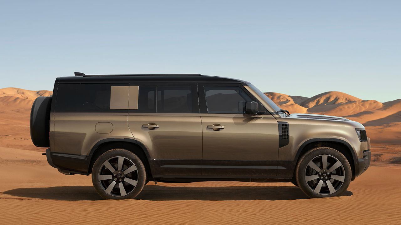 Defender driving in the desert