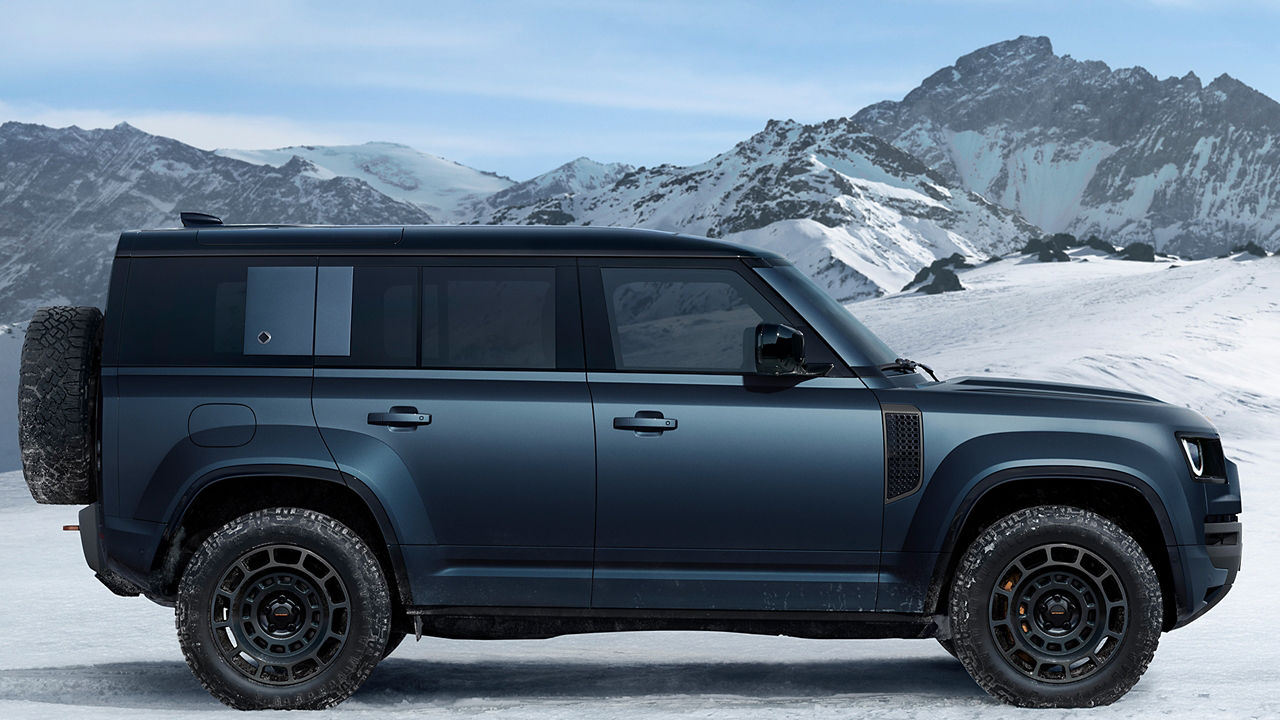 Defender on snow road