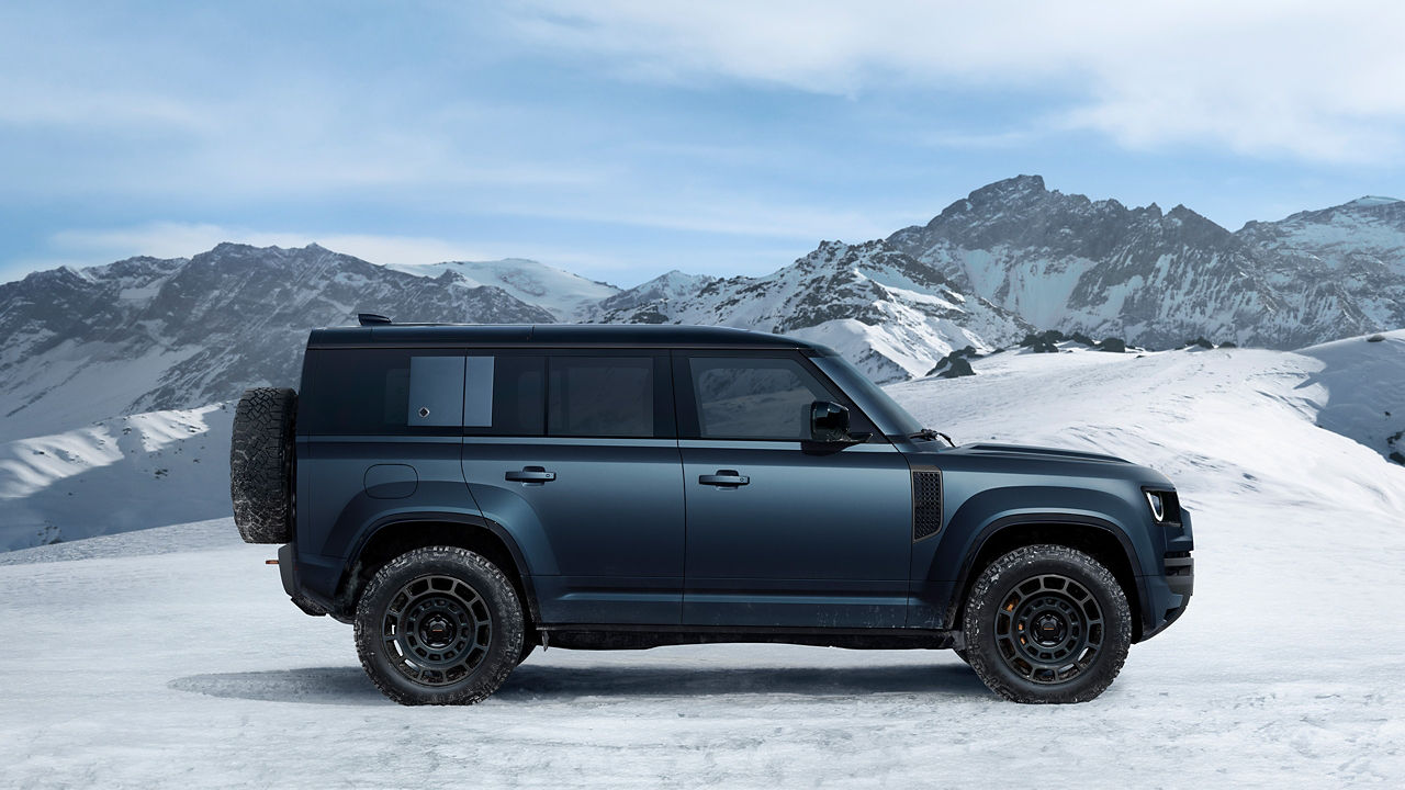 Defender driving on snowy off-road