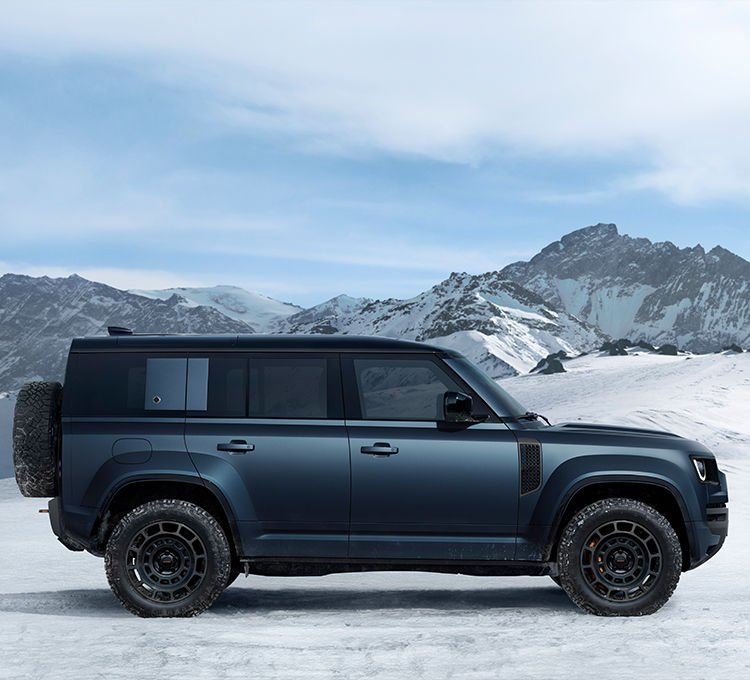 Defender driving on snowy off-road
